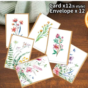 Set of 12 watercolor floral birthday cards with 12 kraft envelopes on wooden table