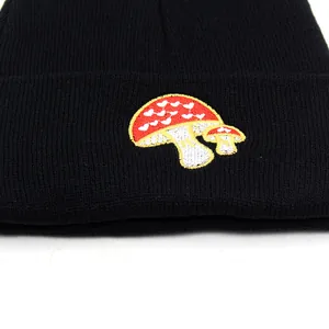 Black knit beanie with colorful mushroom and heart embroidery, warm winter style