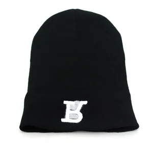 Classic black knitted beanie hat with white TB monogram embroidery for winter warmth