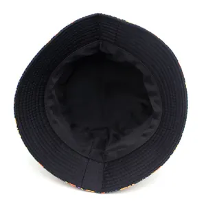 Top view of a bucket hat with Halloween pumpkin prints and a black interior lining