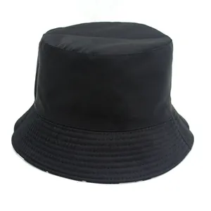 Classic black double-sided cotton bucket hat with polka dot lining and wide sun brim