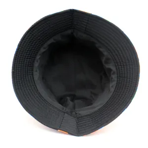 Double-sided camo bucket hat for outdoors with colorful print and black cotton lining