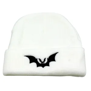 White knitted beanie featuring a black bat embroidery for winter warmth and style