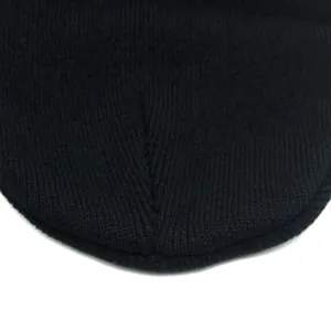 Close-up of black knit beanie crown featuring fine stitching and warm thermal texture