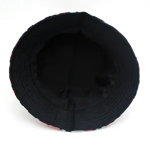 Pink and black leopard print bucket hat with black interior lining from a top-down view