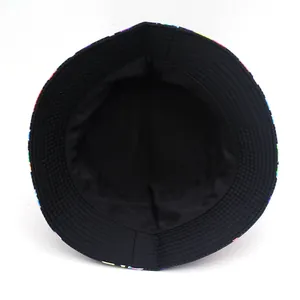 Reversible bucket hat with colorful print and solid black interior for sun protection