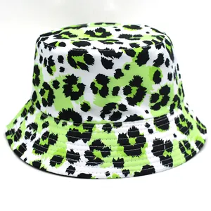 Close-up of leopard print sun hat showing vibrant neon green pattern and stitching details