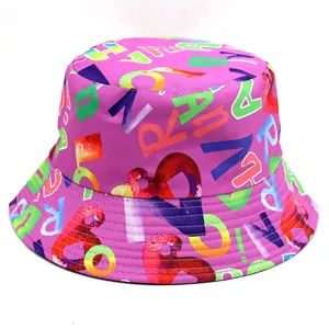 Detail of purple bucket hat with colorful letter prints and reinforced stitched brim