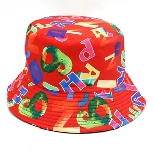 Detail of red bucket hat featuring colorful graffiti letters and reinforced brim stitching