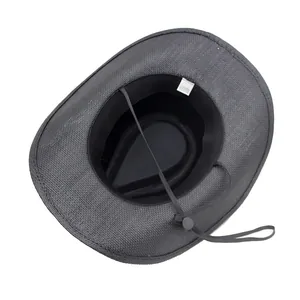 Detail view of black woven straw cowboy hat showing sweatband and adjustable wind rope