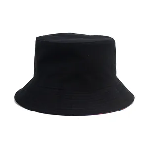 Classic black cotton bucket hat with sun protection brim and inner leaf print pattern