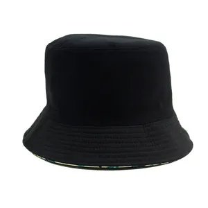 Classic black cotton bucket hat with colorful dinosaur print lining and stitching details