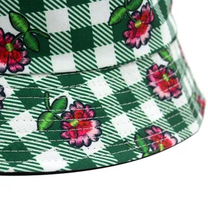 Green diamond grid bucket hat with purple flower print and stitched cotton brim