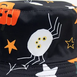 Halloween bucket hat with reversible black canvas featuring pumpkin and spider prints