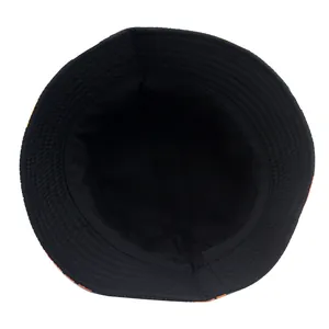 Reversible bucket hat in solid black showing the inner lining and reinforced stitched brim