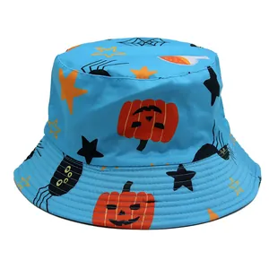Detail of light blue Halloween bucket hat featuring orange pumpkin and spider prints