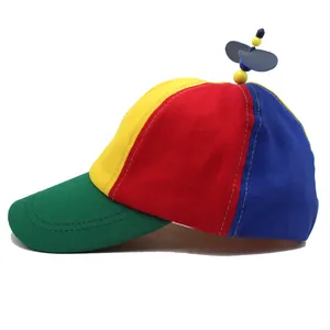 Detailed close-up of a colorful rainbow propeller cap showing high-quality canvas stitching