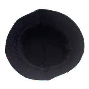 Double-sided bucket hat with starfish and tropical fish print and black inner lining