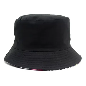 Minimalist black cotton bucket hat with colorful cartoon lining and reinforced brim stitching