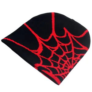 Knitted beanie with red spider web jacquard pattern on black winter warm hat for men and women