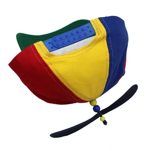 Detail of adjustable blue snapback closure on a colorful rainbow propeller baseball cap