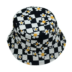 Detail of cotton canvas bucket hat with black and white checkerboard and daisy print