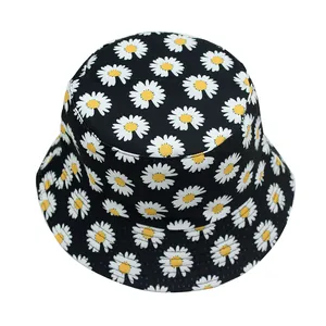 Detail of black reversible bucket hat with white and yellow daisy flower pattern print