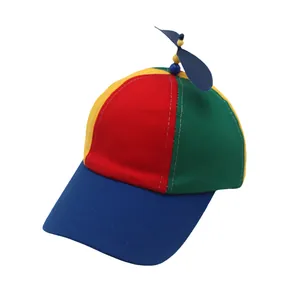 Close-up of a colorful propeller hat showing the blue rotating blades and stitching details