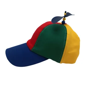 Detailed close-up of rainbow panel baseball cap with a blue top spinning propeller