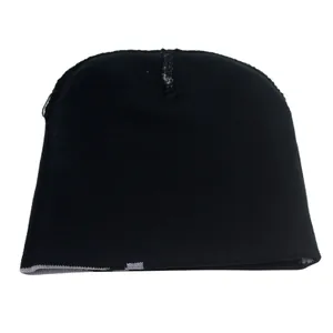 Close-up of black knitted beanie featuring gray spider web jacquard detail and texture