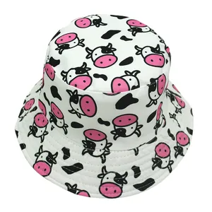 Detailed close-up of cartoon cow print bucket hat featuring high-quality cotton stitching