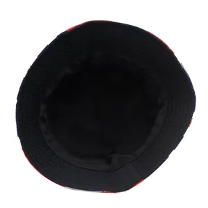 Detail view of bucket hat interior showing black lining and Union Jack plaid pattern edge