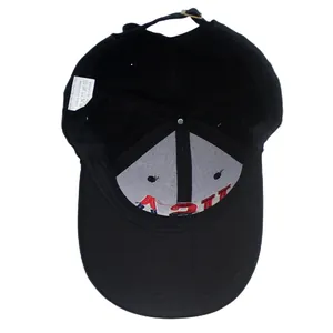 Detail view of the cotton baseball cap interior showing the 100% cotton wash label and stitching