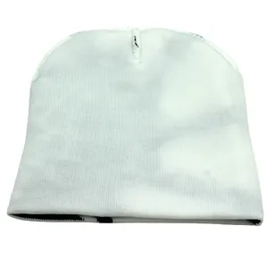 Close-up of white knitted beanie showing vertical rib texture and minimalist design