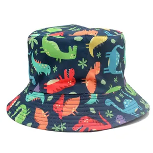 Reversible navy bucket hat for kids with colorful cartoon dinosaur prints and stitching detail