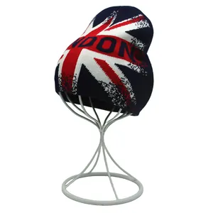 Detail of navy blue knit beanie featuring Union Jack pattern and London text embroidery