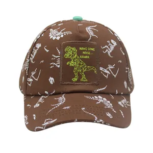 Close-up of kids dinosaur baseball cap with embroidered patch and green T-Rex detail