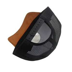 Detail view of the breathable mesh back and adjustable snapback closure on the trucker hat