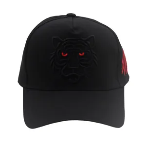 Detail of red scratch embroidery and tiger head texture on black cotton baseball cap