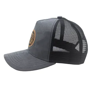 Detail view of trucker hat with embroidered faux suede front and breathable mesh back