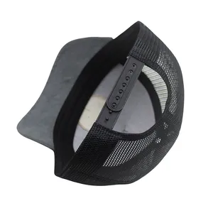 Detail view of the black mesh trucker hat showing the adjustable snapback closure