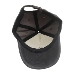 Internal detail of washed cotton baseball cap featuring black sweatband and reinforced seams