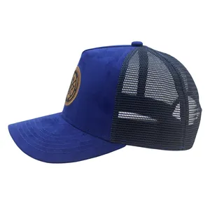 Detail of the navy suede trucker hat with round leather patch and breathable mesh back