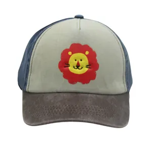 Detail of color-block kids baseball cap featuring a cute cartoon lion print