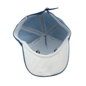 Détails internes de la casquette enfant montrant coutures renforcées et boucle métallique