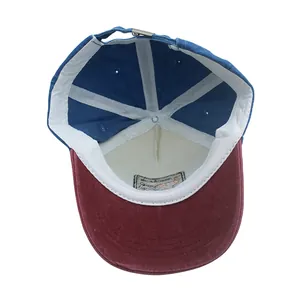 Interior view of kids dinosaur baseball cap showing cotton fabric and metal buckle