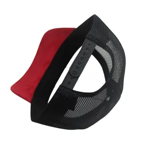 Detail view of red trucker hat featuring black mesh back and adjustable snapback closure
