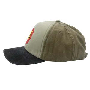 Detail view of corduroy texture and cartoon lion patch on kids' baseball cap
