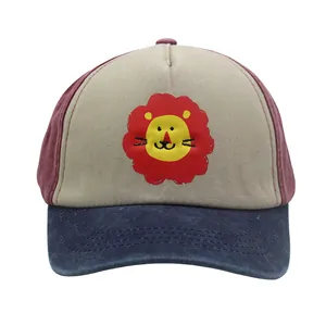 Close-up of the cartoon lion patch on this tricolor washed cotton kids baseball cap