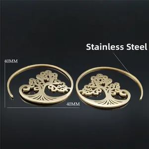 Boucles d'oreilles spirales bohème en acier doré avec découpes arbre de vie 40mm